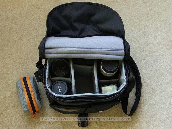 LOWEPRO STEALTH REPORTER D300\n\nFoto von Jrgen Vogel - DANKE DAFR !\n\nKommentar des Nutzers:\n\nBild1: geschlossen, relativ kompakte abmessungen (alltagstauglich) \nBild2: geffnet: praktische taschen fr kleinzeug, handy, schlssel, etc.\nBild3: zu sehen: 70-200L, 420EX, PD70X, 50 1.4 (darber der kenko 1.5), 85 1.8 (darber nahlinse 250d)\nBild 4: praktisches zubehr \nBild5: angenehmer tragegurt, ergnzungsschlaufen fr zubehr wie kcher etc., talliengurt\n\nSmtliche bilder wurden mit der mark2 u. dem 28-70L 2.8 aufgenommen welche auch noch problemlos ihren platz findet.\n(alternativ dazu natrlich jedes andere standardzoom)\nauch das 70-200 passt angesetzt rein, was jedoch nur als notlsung vorstellbar ist.